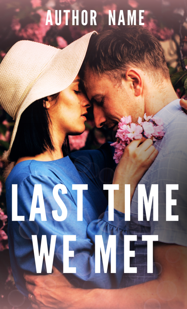 A romantic Premade Ebook & Paperback Book Cover titled "Last Time We Met." The image shows a close-up of a couple standing face to face, gently touching foreheads. The woman wears a light sunhat and a blue dress, holding pink flowers. The man has short hair and wears a light-colored shirt. Flowers bloom in the background. BookSelf Book Cover Design & Premade Book Covers