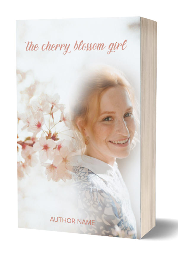 The cover of a book titled "The Cherry Blossom Girl" features an image of a smiling woman with light hair, overlaid with soft-focus cherry blossoms in light pink and white hues. The book's author is not specified (the text reads "AUTHOR NAME"), and the overall design has a light, airy aesthetic. BookSelf Book Cover Design & Premade Book Covers